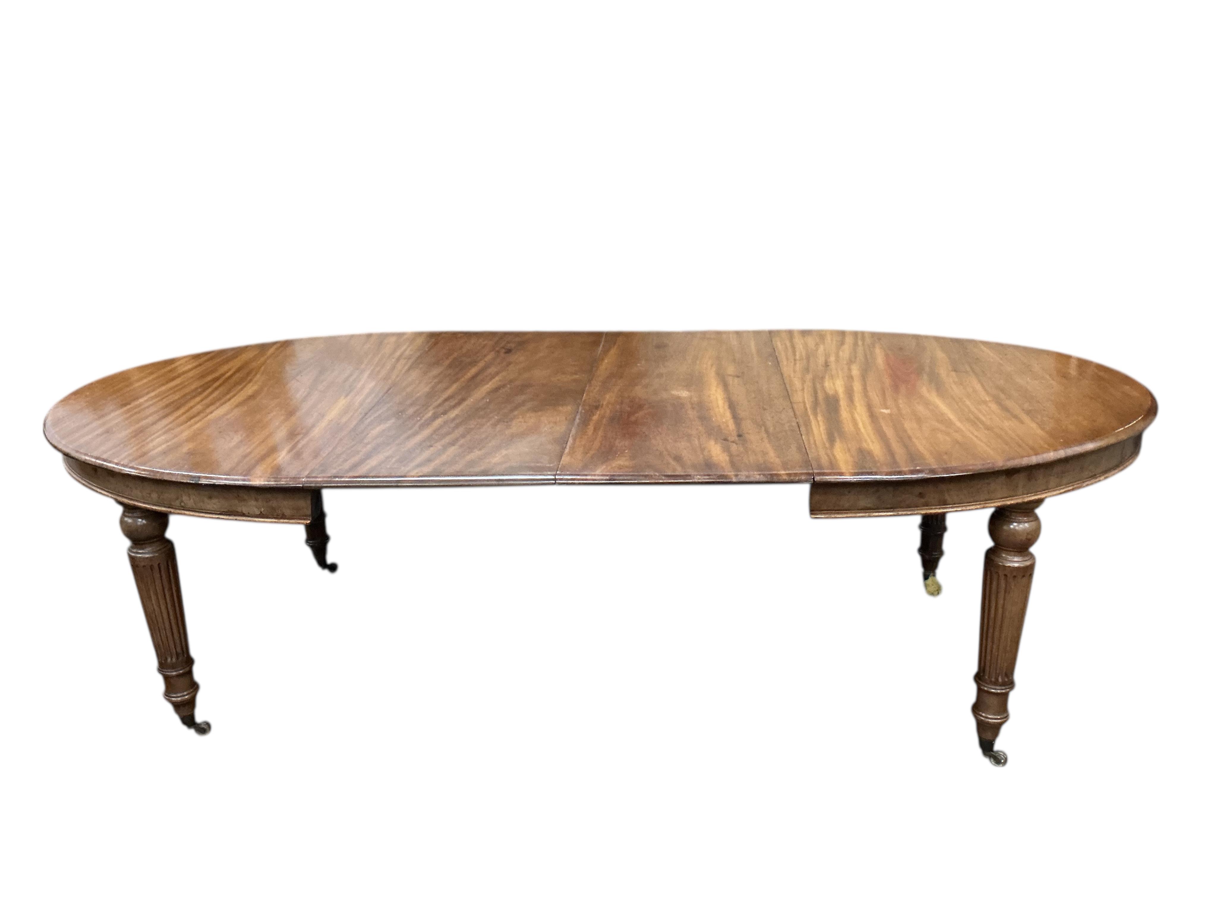 A Victorian mahogany dining table, two spare leaves, 244cm extended, depth 115cm, height 71cm
